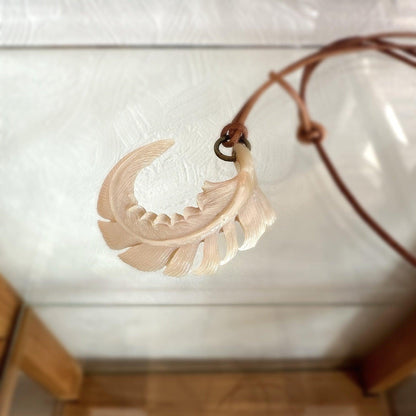 Feather (Chinese turban shell) pendant