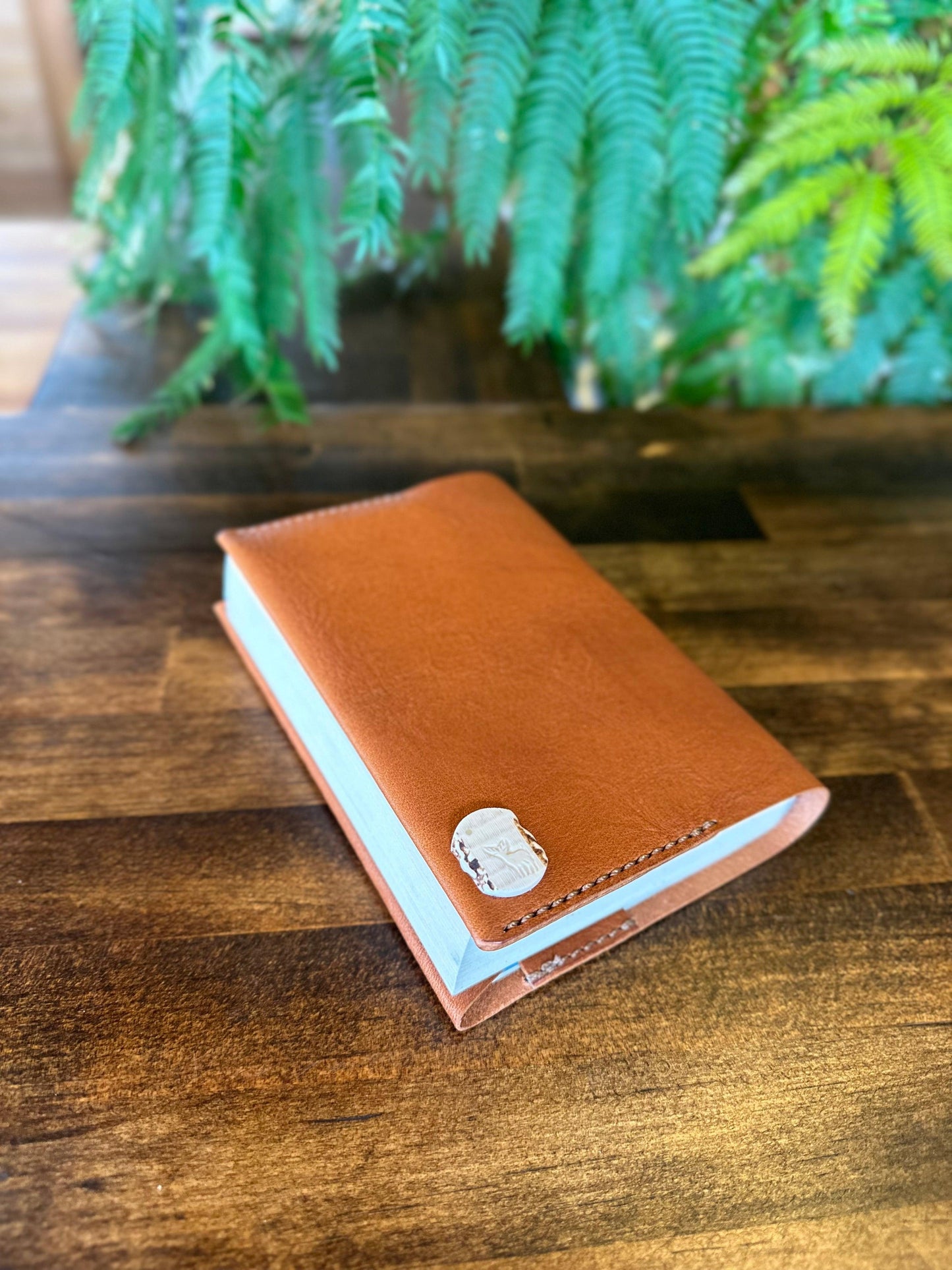 Paperback book cover, brown (Tochigi leather, Yaku deer horn, luminous shell buttons)