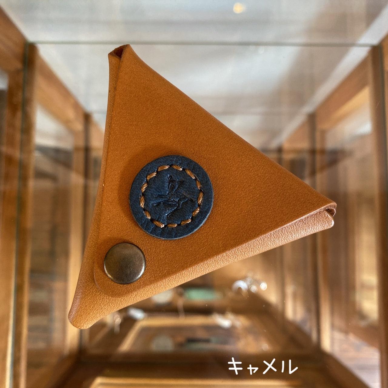 Triangular coin case with Cow