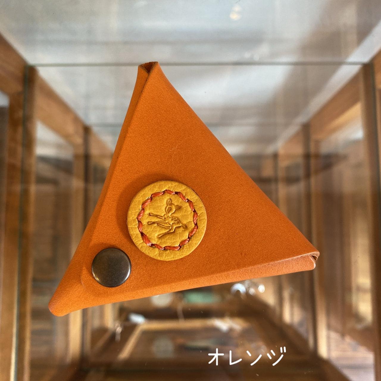 Triangular coin case with Cow